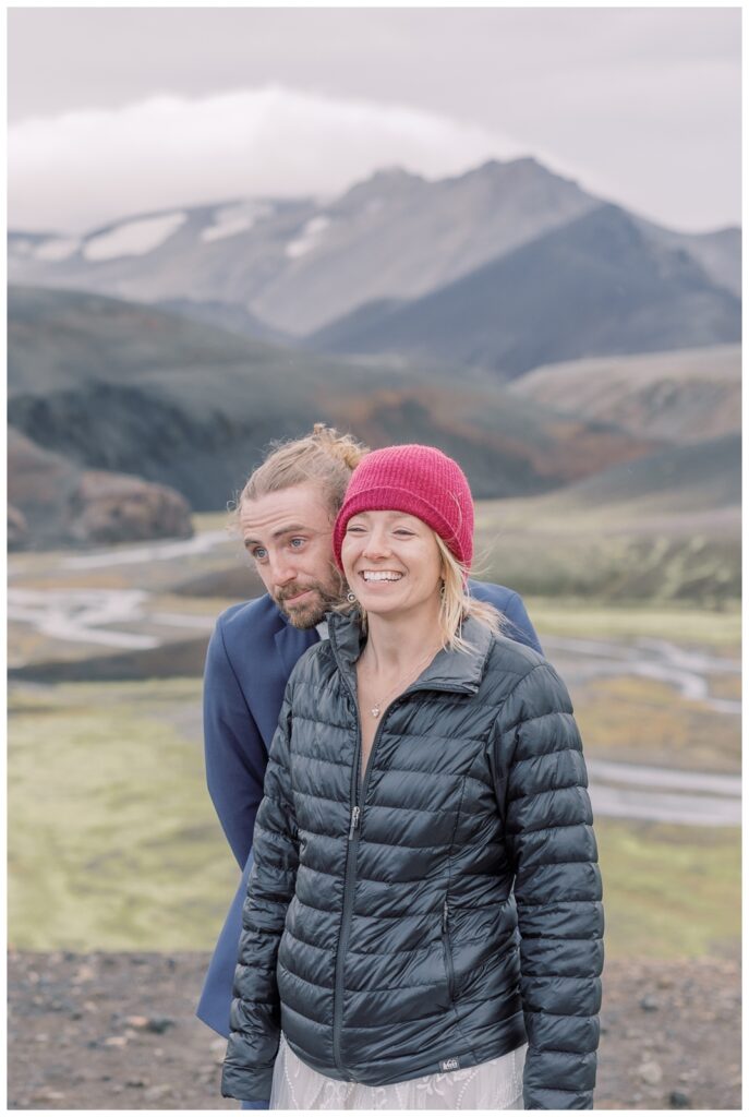 Couple bundled up together during their elopement in Iceland.