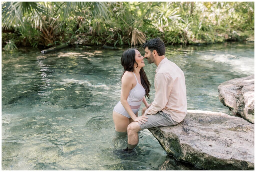 Couple cooling off in the springs at Kelly Park during their elopement in the Winter which is one of the best times of the year to elope in Florida.
